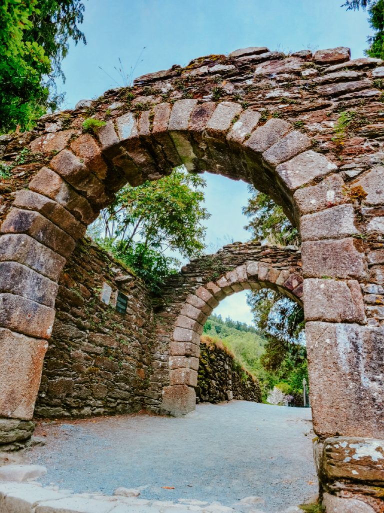 Stone arch entryway into the monastic site in Glendalough, Ireland.
